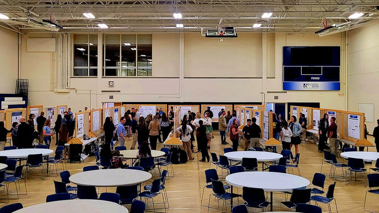 Students, faculty, and guests interact at the annual Undergraduate Research and Creative Activities Fair
