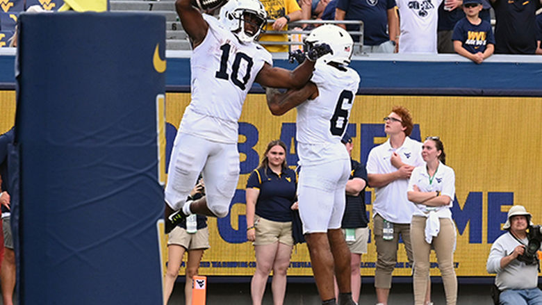 Singleton jumps in air in celebration
