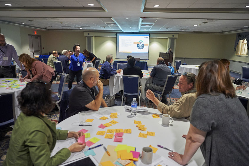 Group of people sitting around a table during workshop