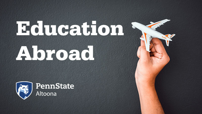 Education Abroad at Penn State Altoona. Toy plane held by hand.