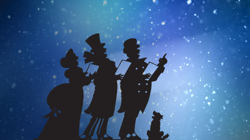 Carolers in Silhouette over a blue, snowy sky