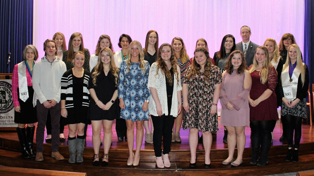 Newly inducted members of Kappa Delta Pi pose with their advisors