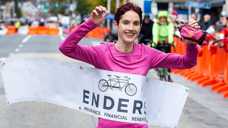 Lacey Wallace crossing the finish line at the Harrisburg Marathon