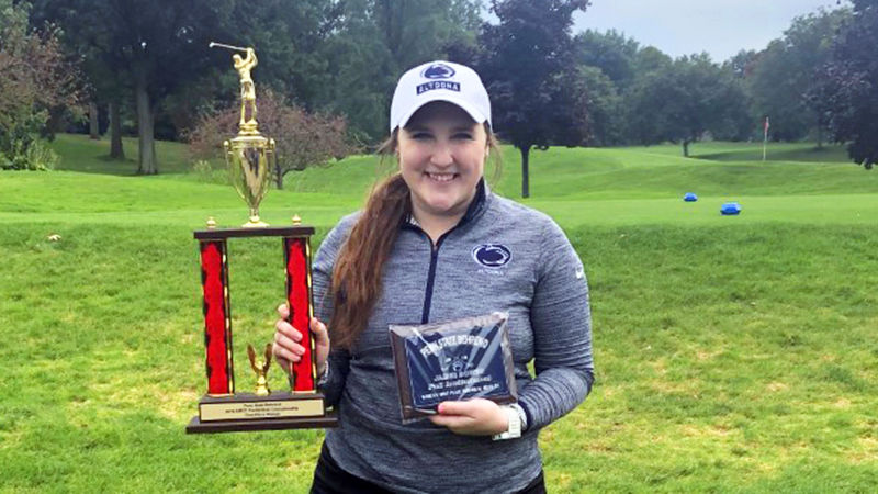 Katie Pupillo poses with her championship trophy and award