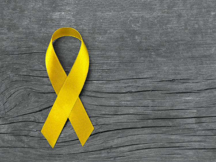 A yellow ribbon representing suicide awareness and prevention