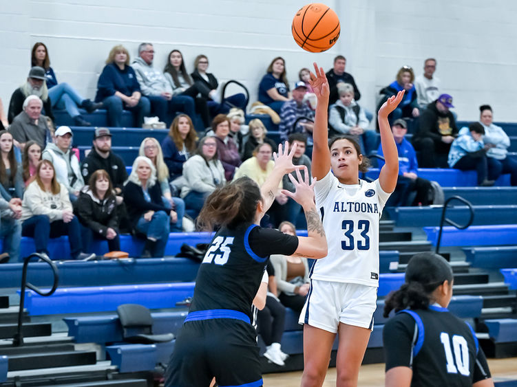 Penn State Altoona student-athlete Avana Sayles playing in a basketball gams