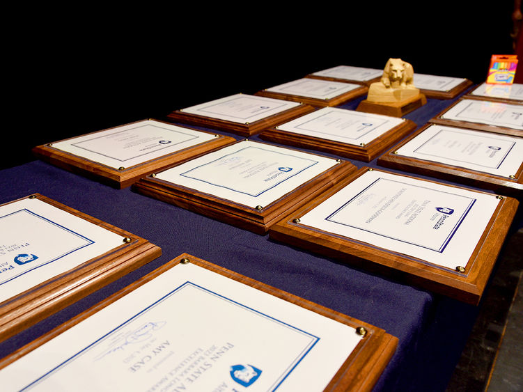 Plaques and trophies from the spring 2023 Penn State Altoona faculty and staff awards
