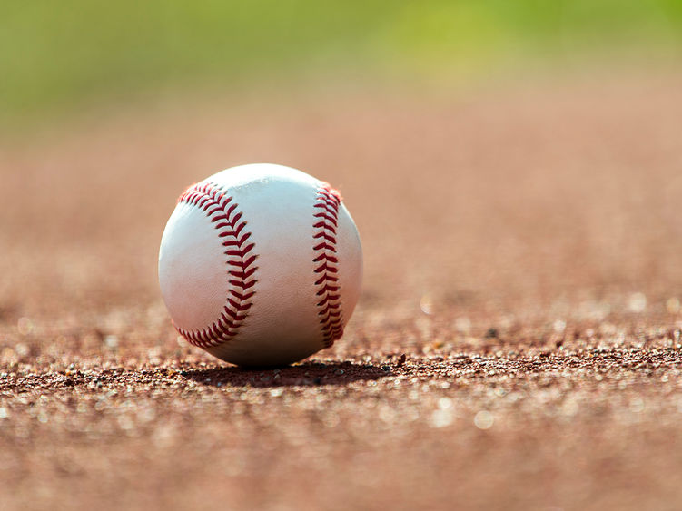 A baseball on the ground