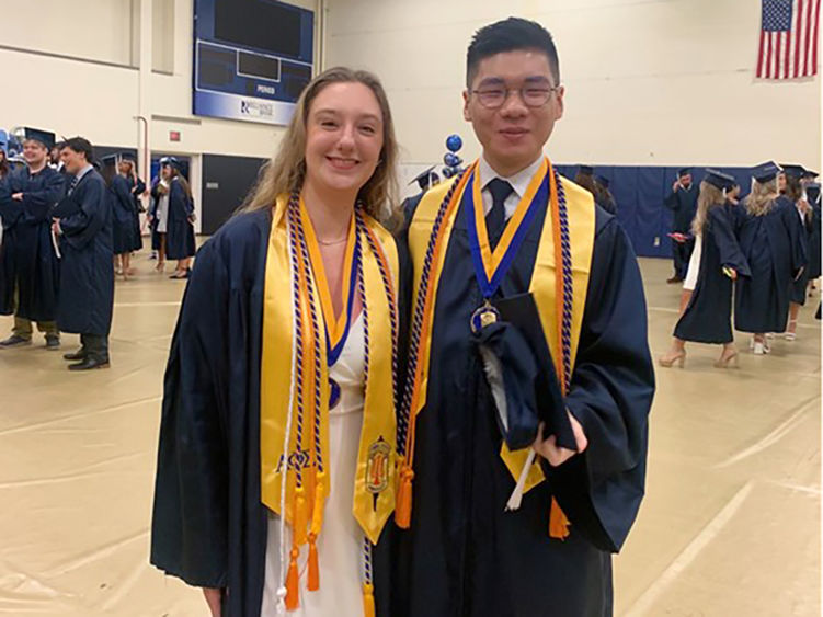 Jazzmine McCauley (left) with Ziwei (Will) Lin at the 2024 Penn State Altoona spring commencement ceremony