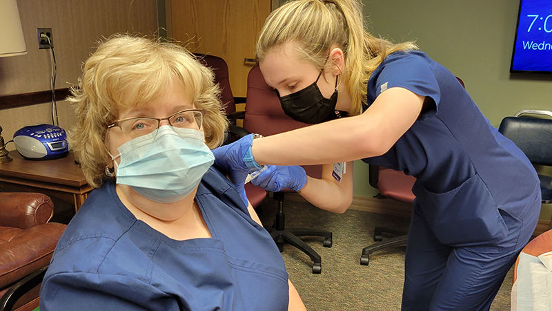 Altoona nursing student administers a flu vaccine