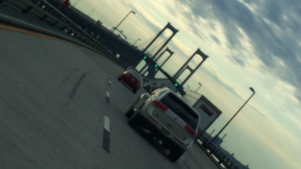 Cars driving across a bridge