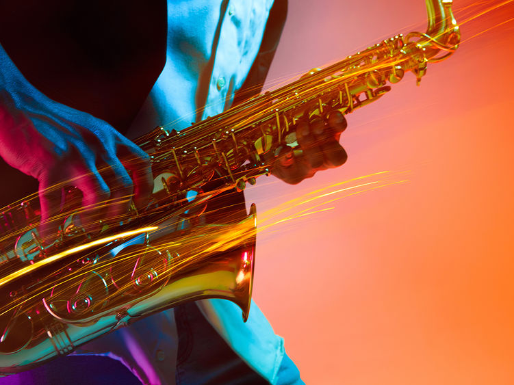 a close-up of a saxophone being played