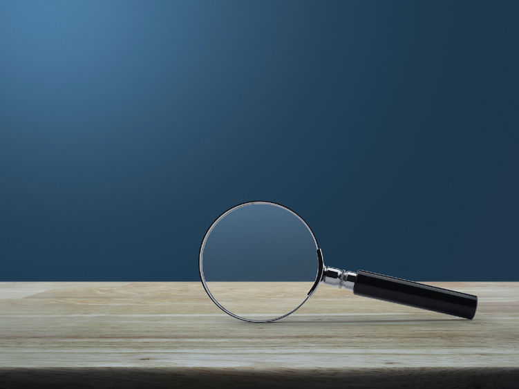 A magnifying glass laying on a table