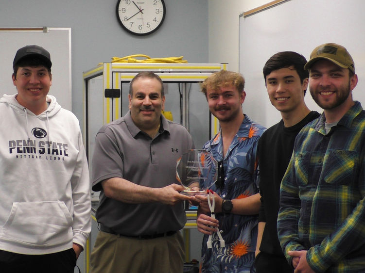 Dr. Grant Risha poses with the student team chosen as best performers in the spring 2025 Engineering Design Competition