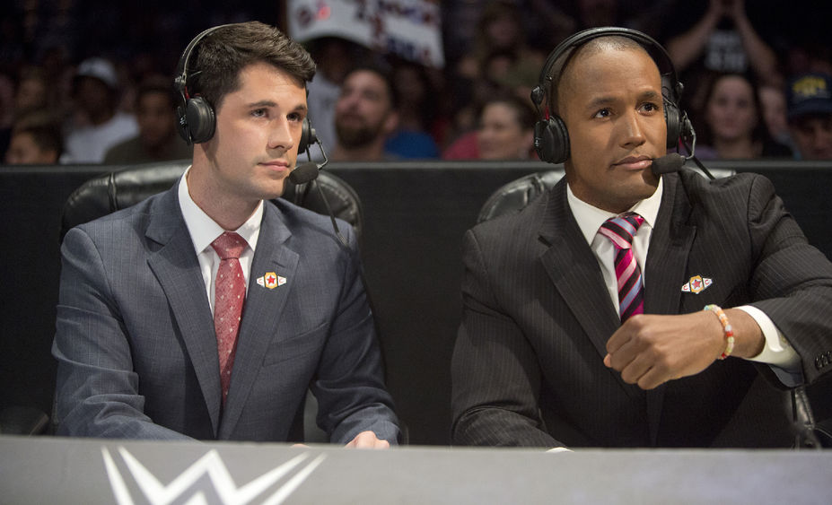 Tom Hannifan at WWE desk with Byron Saxton