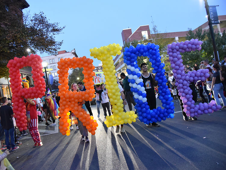 Five students hold balloons spelling PRIDE in the 2019 Altoona Pride Parade