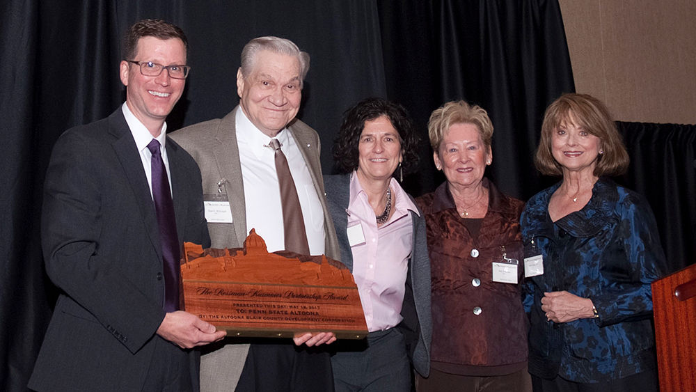 Lori J. Bechtel-Wherry accepts the Rossman-Kazmaier award on behalf of the campus